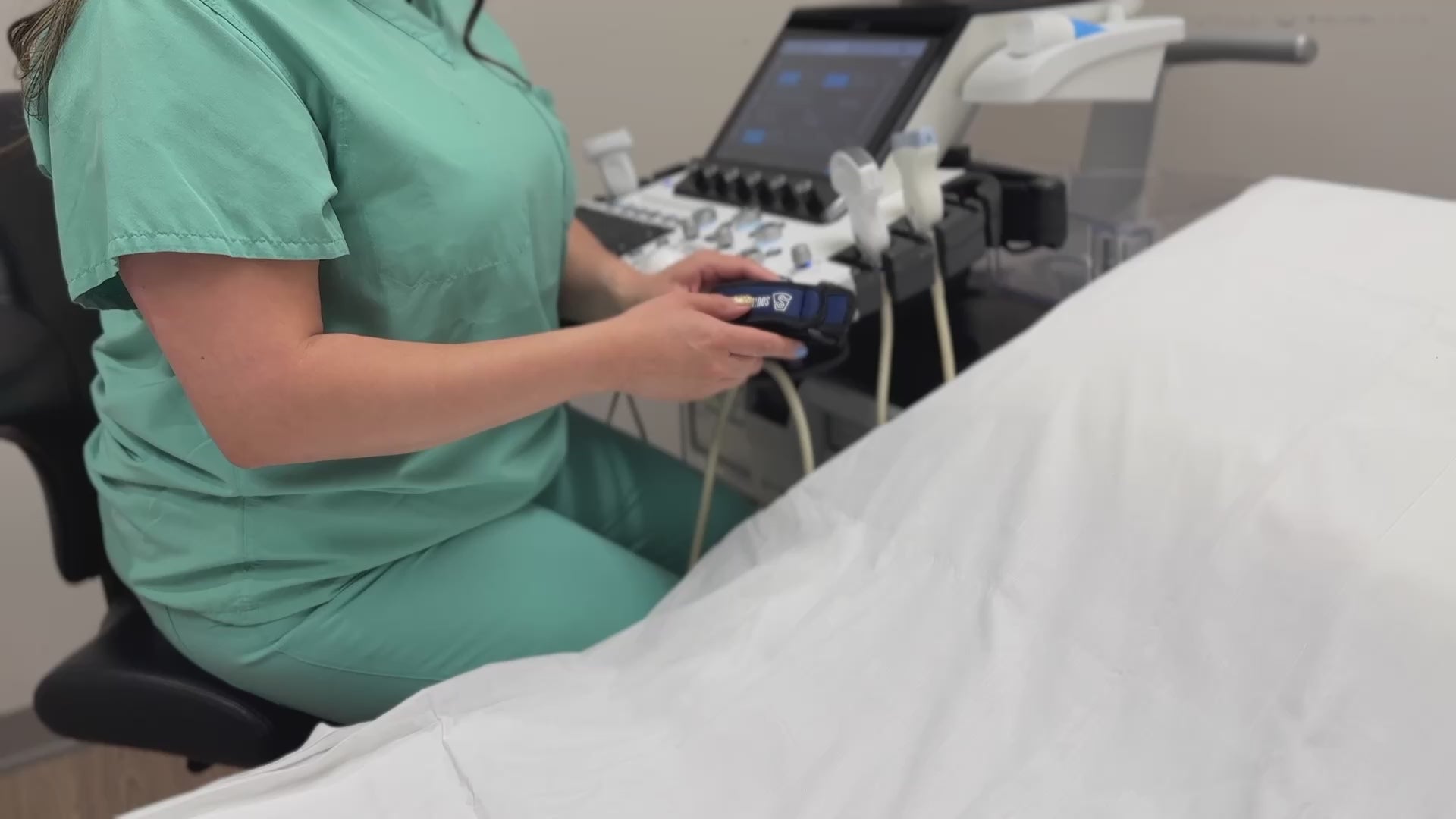 Load video: Nurse demonstrating how to pu ton cable brace with velcro strap